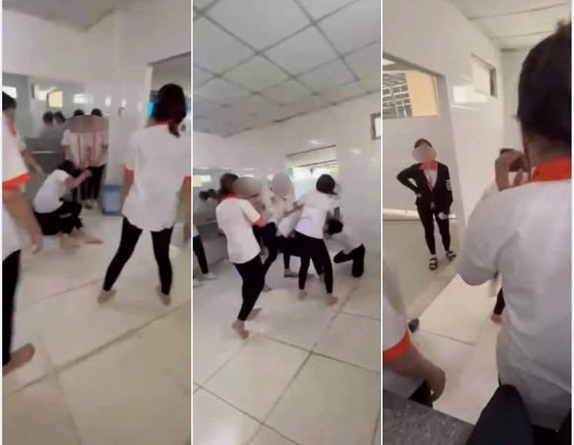 Nhóm nữ sinh đấm, đá liên tiếp vào vùng đầu khiến nạn nhân chỉ biết ôm đầu chịu trận. Ảnh: Báo Lao động.