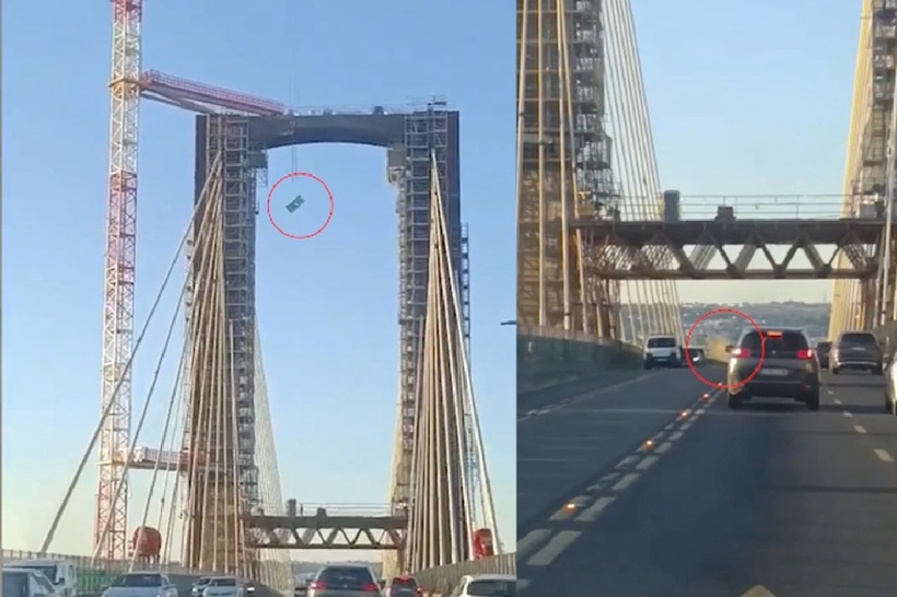 Một nhà vệ sinh di động bất ngờ rơi ở độ cao hơn 30m từ cần cẩu xuống đường vành đai. Ảnh: Báo Dân trí.