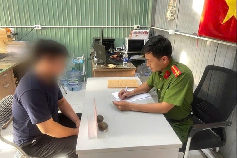 Ông K. tại cơ quan công an. Ảnh: Người lao động