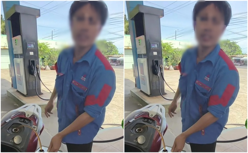 Hình ảnh nhân viên cửa hàng hút lại toàn bộ số xăng đã bơm vào xe máy của khách. (Ảnh: VietnamNet)