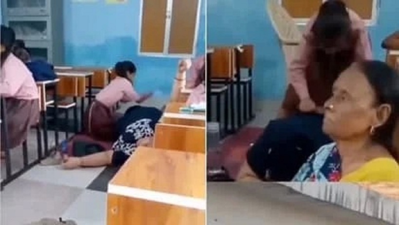 Hiệu trưởng để học sinh xoa bóp chân trong lớp học. Ảnh cắt từ clip