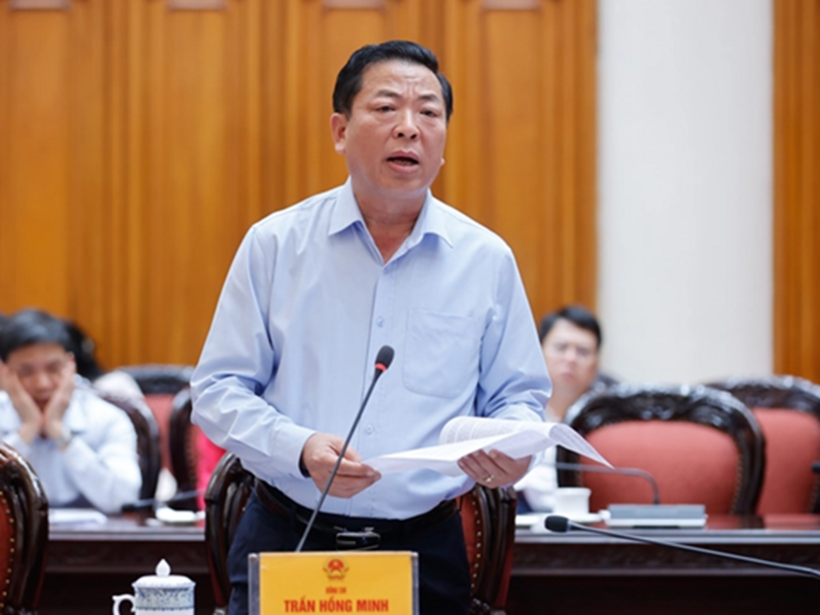 Bộ trưởng Bộ Xây dựng Trần Hồng Minh báo cáo tại cuộc họp (Ảnh: VGP).