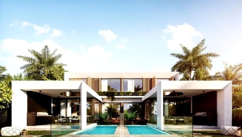 Mặt tiền biệt thự song lập 2 tầng hiện đại này được thiết kế theo phong cách tối giản, với những mảng khối vuông vắn, khỏe khoắn. Không gian thoáng mát kết hợp bể bơi là điểm nhấn của mẫu thiết kế này. (Ảnh: Vinavic)