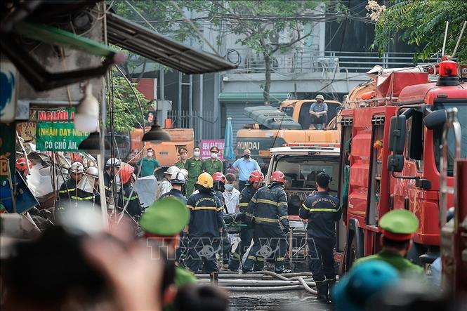 Lực lượng chức năng tại hiện trường. Ảnh: TTXVN