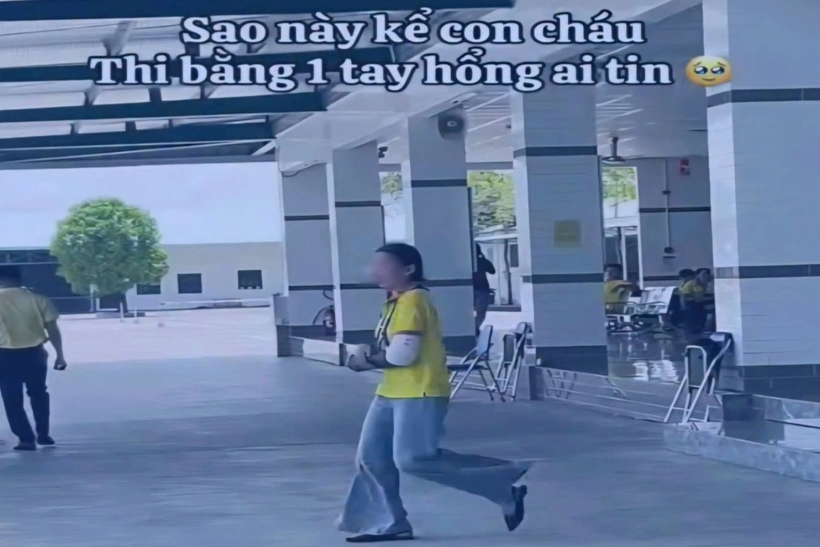 Hình ảnh người phụ nữ bó bột tay trong clip (Ảnh cắt từ clip/Dân Trí)