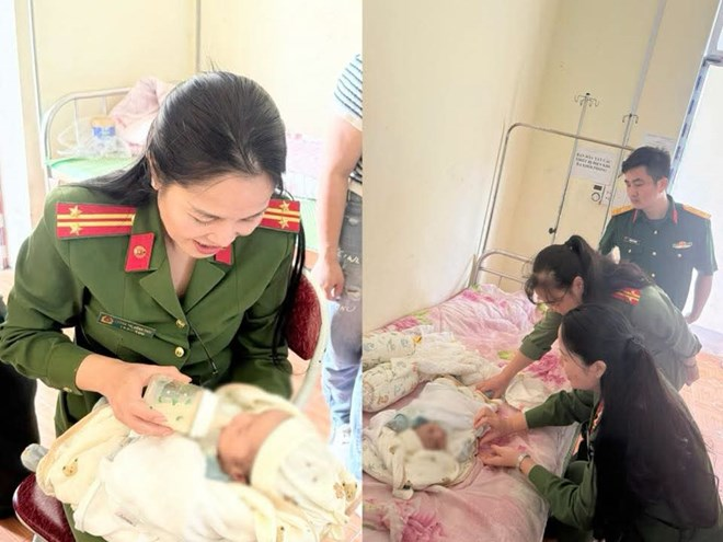 Lực lượng chức năng chăm sóc bé trai sơ sinh bị bỏ rơi. Ảnh: Công an tỉnh Tuyên Quang