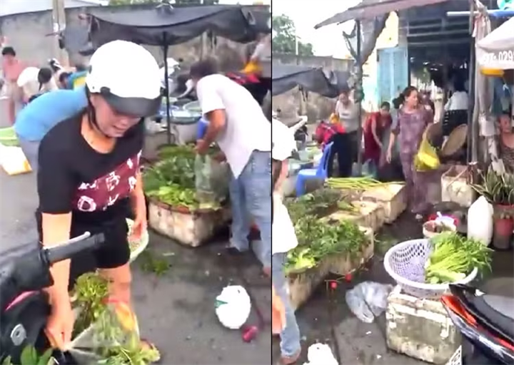 Hình ảnh nhiều người đến lấy rau tại quầy hàng của ông Đ. sau khi ông biết trúng số đã bỏ lại hàng cho mọi người tự do tới lấy. Ảnh cắt từ clip.
